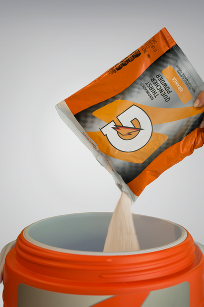 Gatorade powder poured into team cooler